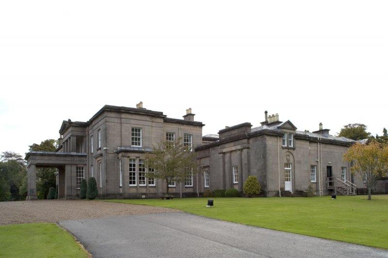 A photo of Aberlour House: a sprawling, multi-story stone mansion.